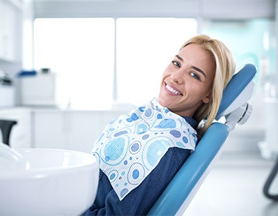 Smiling woman sitting in dental office